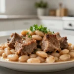 Délicieuse palette de porc aux haricots blancs cuisinée au Cookeo pour un repas réconfortant.
