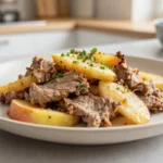 Savoureux sauté de porc aux pommes préparé au Cookeo, alliant tendreté et douceur des fruits.